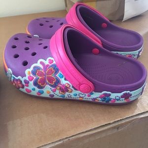 Two pairs crocs sandals